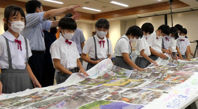 宇宙横断幕が地球に帰還、子どもたちが開封